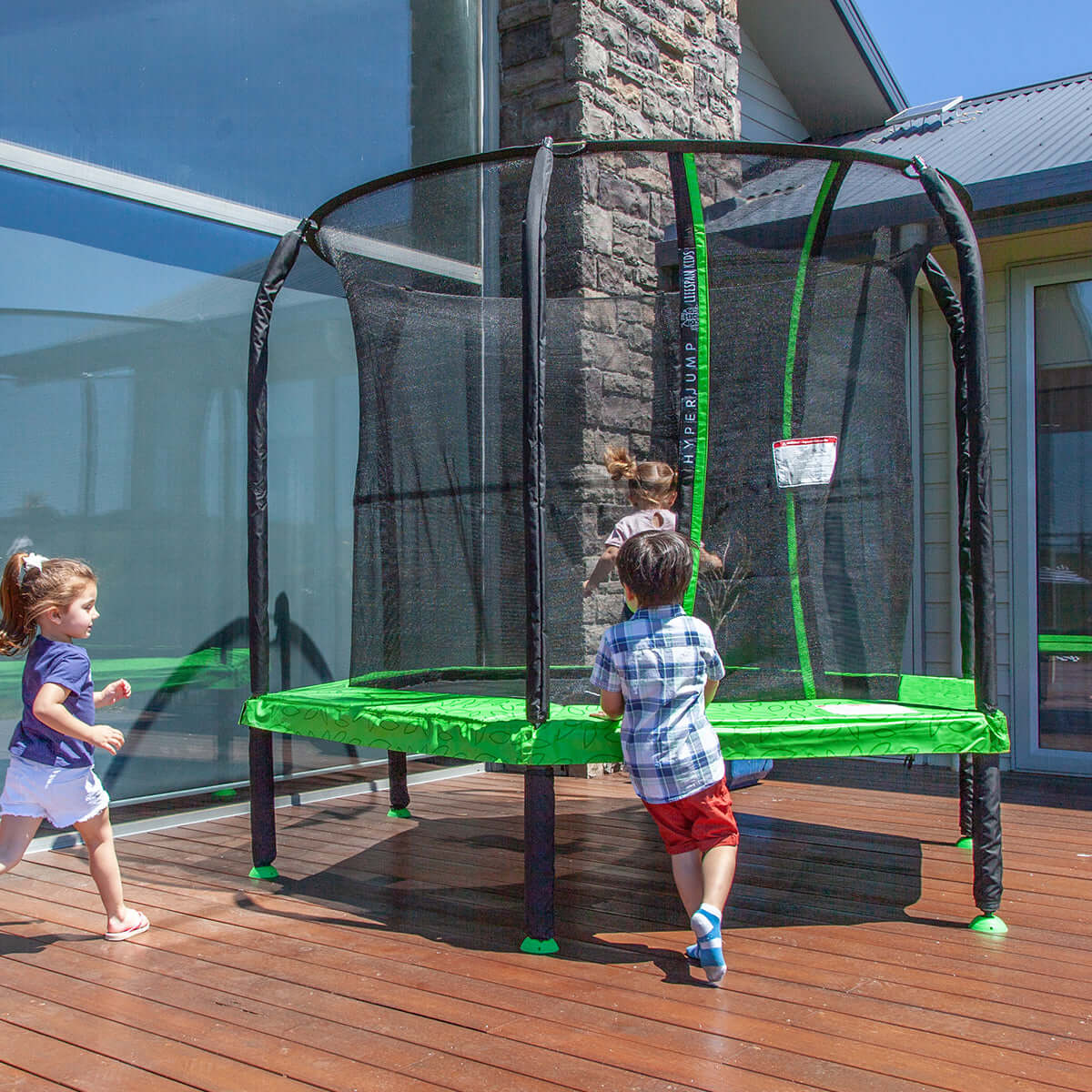 Kids playing on a budget-friendly trampoline outdoors, enjoying quality and affordable fun.