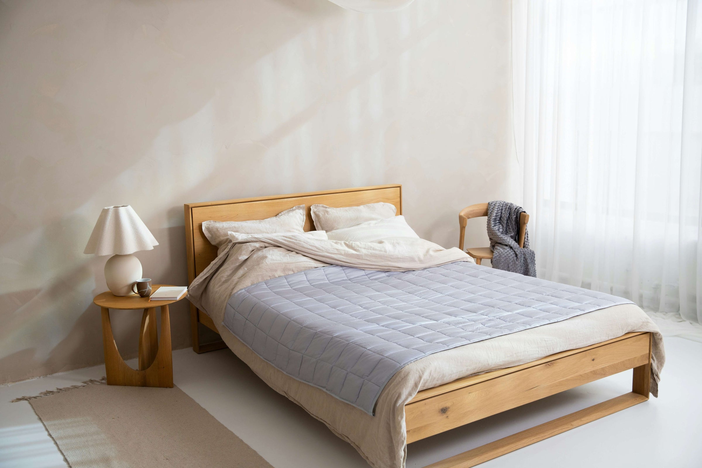 Affordable elegant bedroom with stylish wooden bed and cozy decor perfect for transforming your space on a budget.