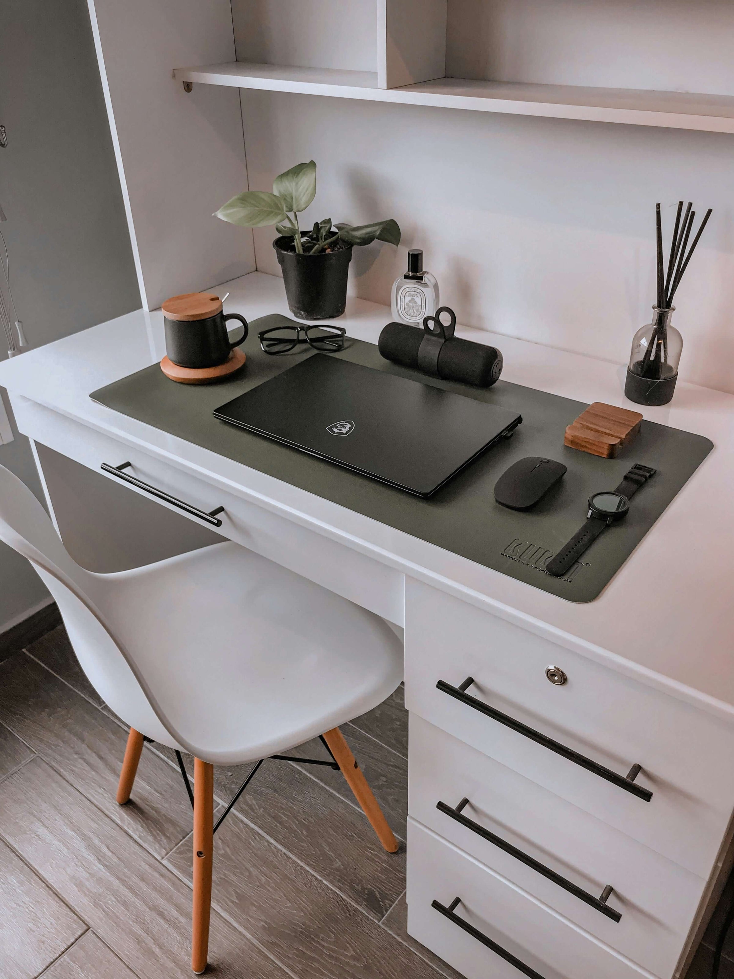 Sleek office desk setup with laptop and accessories, highlighting a budget-friendly, quality workspace from S & D's Value Store.