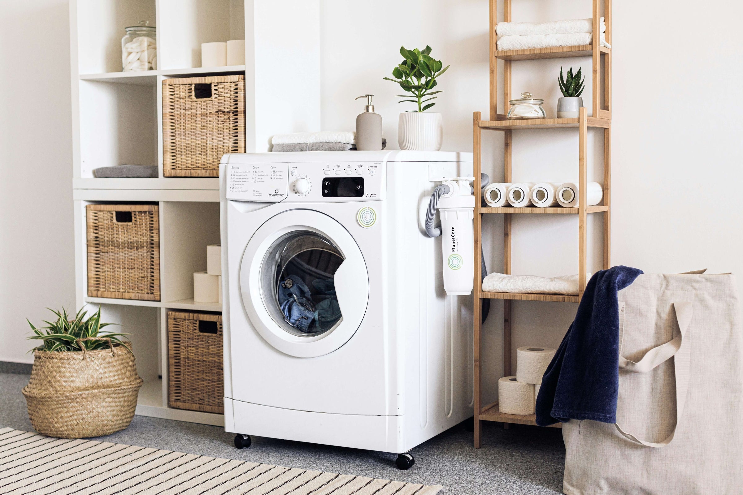 Stylish and affordable washing machine in a modern laundry room with storage baskets and plants.