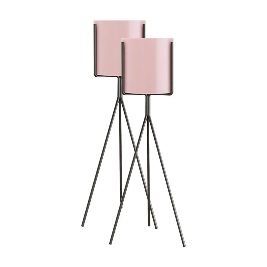 Stylish affordable homewares - quality pink metal flower pots with tall black stands, perfect value furniture for modern interiors.