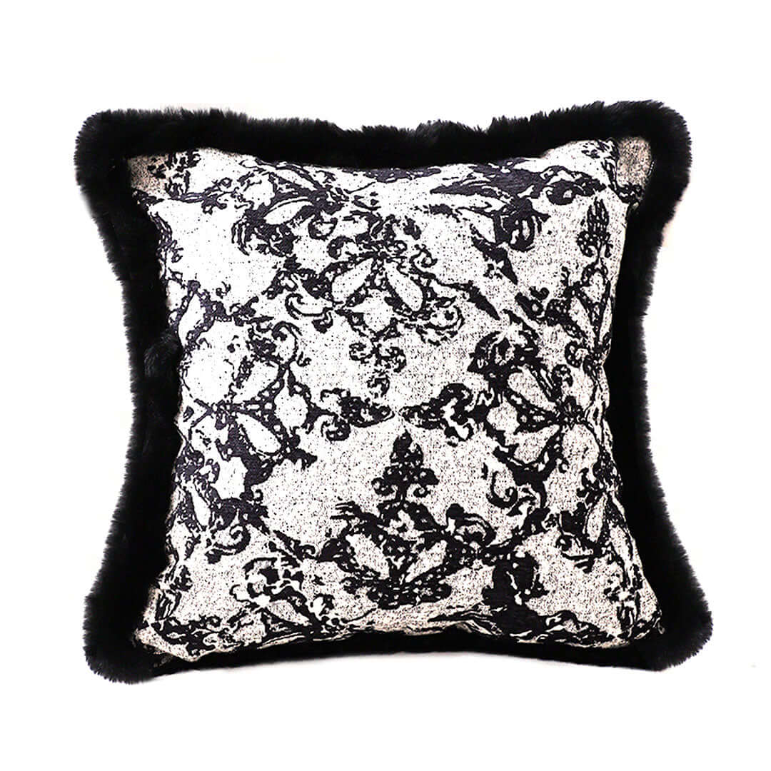 Elegant black and white patterned cushion with faux fur trim, perfect for adding affordable luxury to your homewares and furniture.