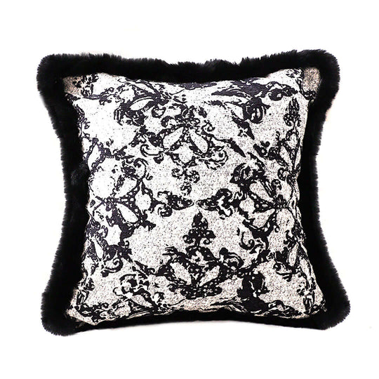 Elegant black and white patterned cushion with faux fur trim, perfect for adding affordable luxury to your homewares and furniture.