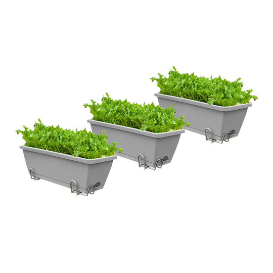 Affordable quality homewares - three grey planters with lush green plants. Perfect value furniture for home gardening and decor.