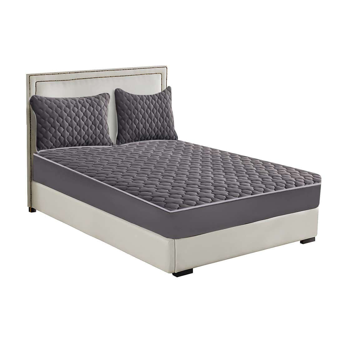 Affordable high-quality bed with grey quilted mattress and pillows, offering excellent value furniture for home comfort and style.