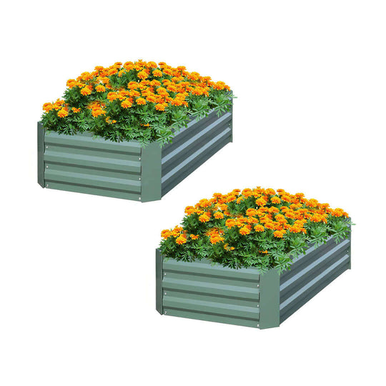 Affordable quality homewares - Two value furniture metal garden beds filled with vibrant marigold flowers.