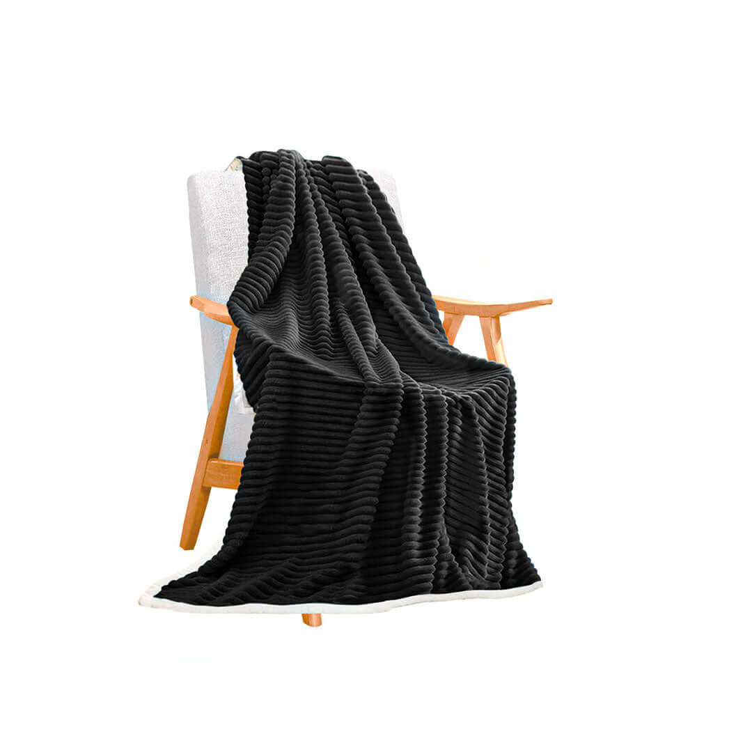 Black textured throw blanket draped over a wooden chair, showcasing affordable and quality homewares and value furniture.