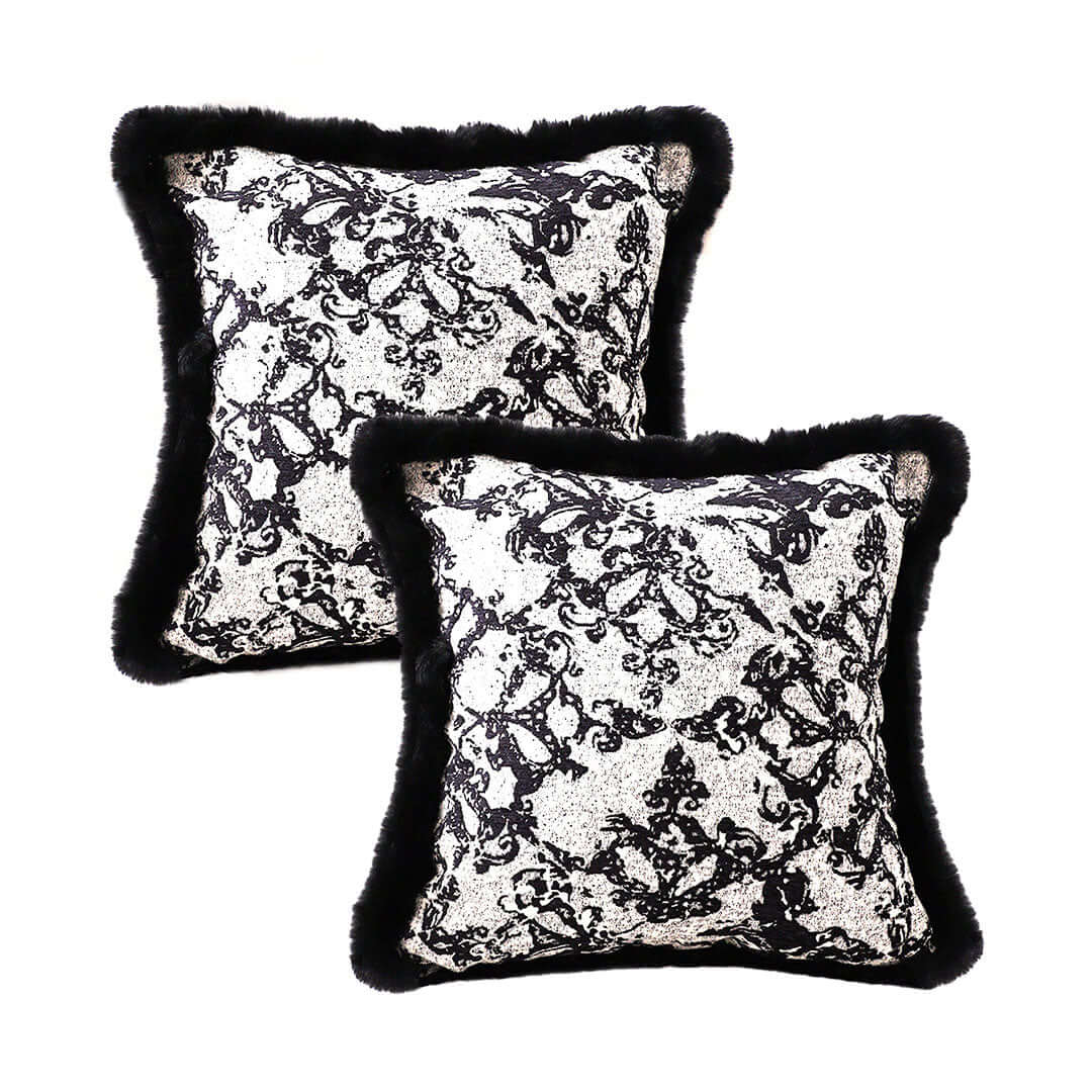 Affordable quality homewares - value furniture with decorative black and white throw pillows featuring intricate patterns.