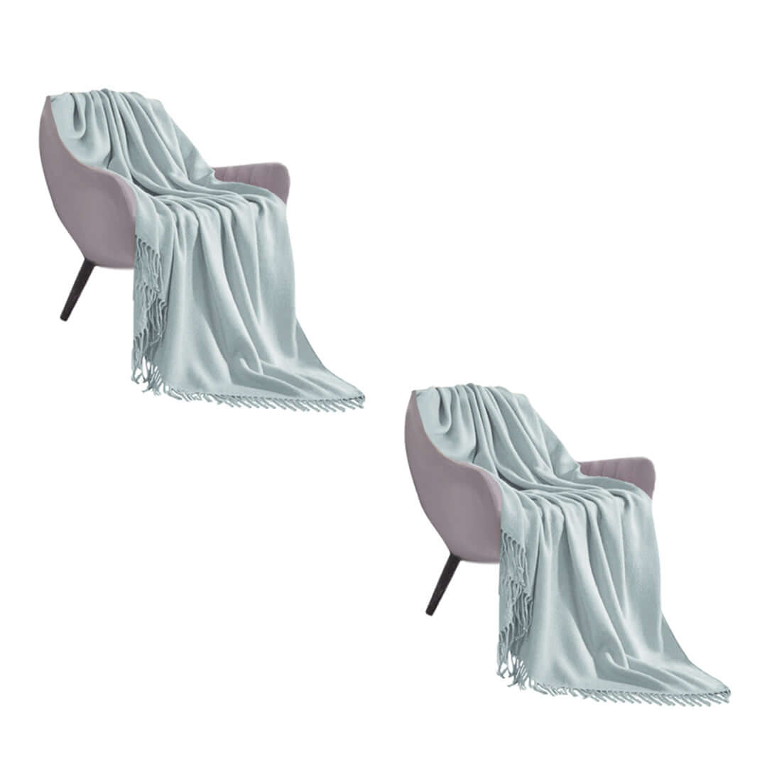 Affordable quality homewares - Set of two gray armchairs with elegant light blue throws, highlighting value furniture.