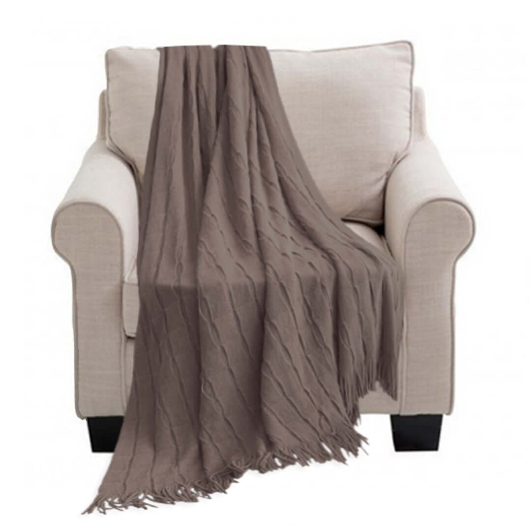 Beige armchair with a stylish taupe throw blanket, showcasing affordable homewares and quality value furniture.