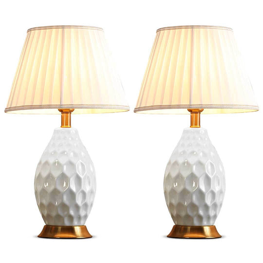 Elegant pair of affordable homeware lamps with a white textured base and cream shade, offering quality and value furniture for any room.