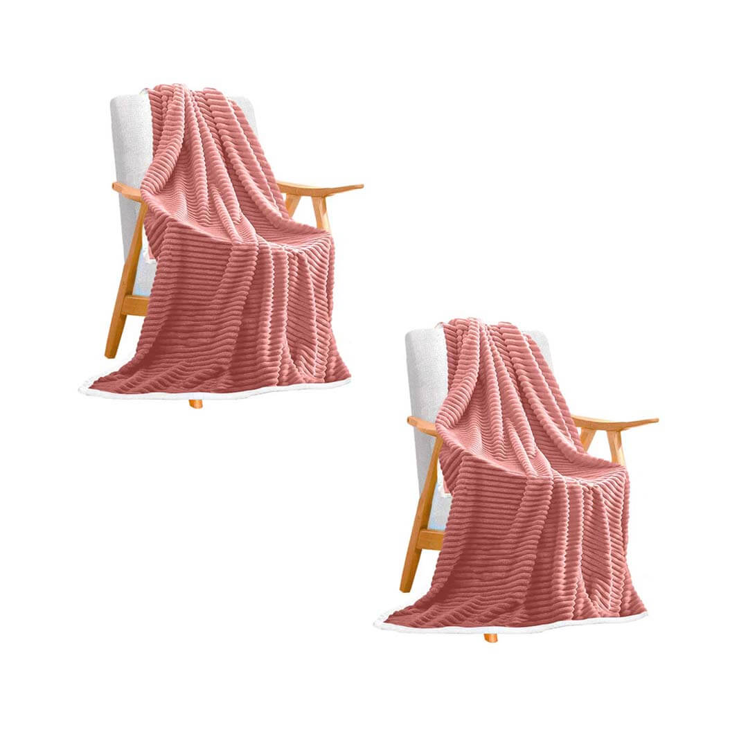 Affordable quality homewares - two cozy chairs with soft pink throws, offering comfortable value furniture solutions.