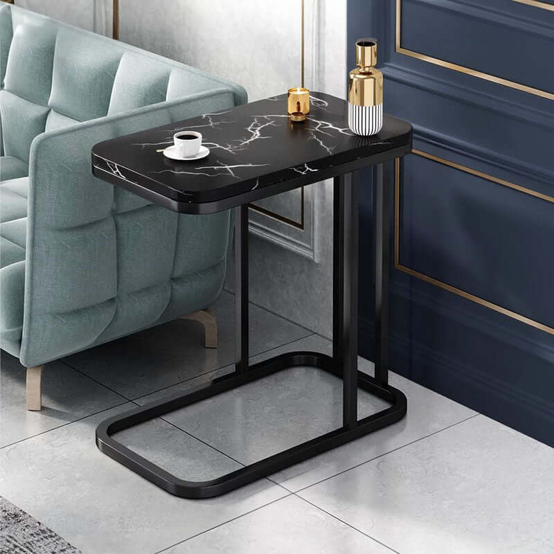 Affordable homewares quality marble side table with black metal frame beside green armchair - value furniture option