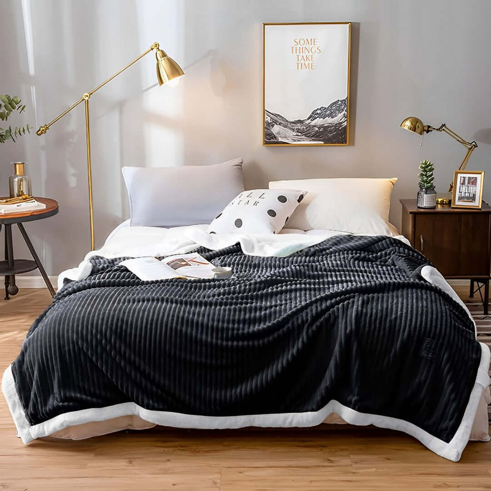 Cozy bedroom with stylish black and white bedding, a modern lamp, and affordable homewares showcasing value furniture and quality decor.