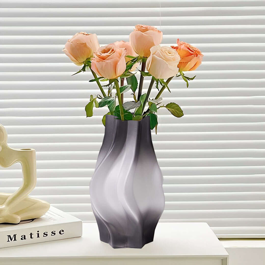 Affordable homewares - Quality black and white vase with pink roses on white shelf, enhancing value furniture décor.