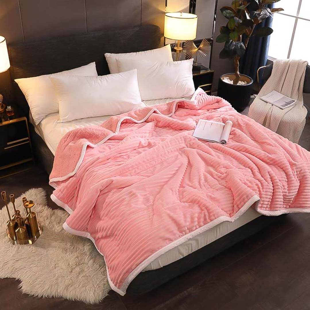 Affordable quality homewares - cozy pink bed cover and pillows in a stylish bedroom setup. Find value furniture for your home.