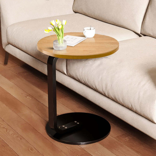 Affordable quality value furniture homeware side table with wooden top and black metal base placed beside a beige sofa.