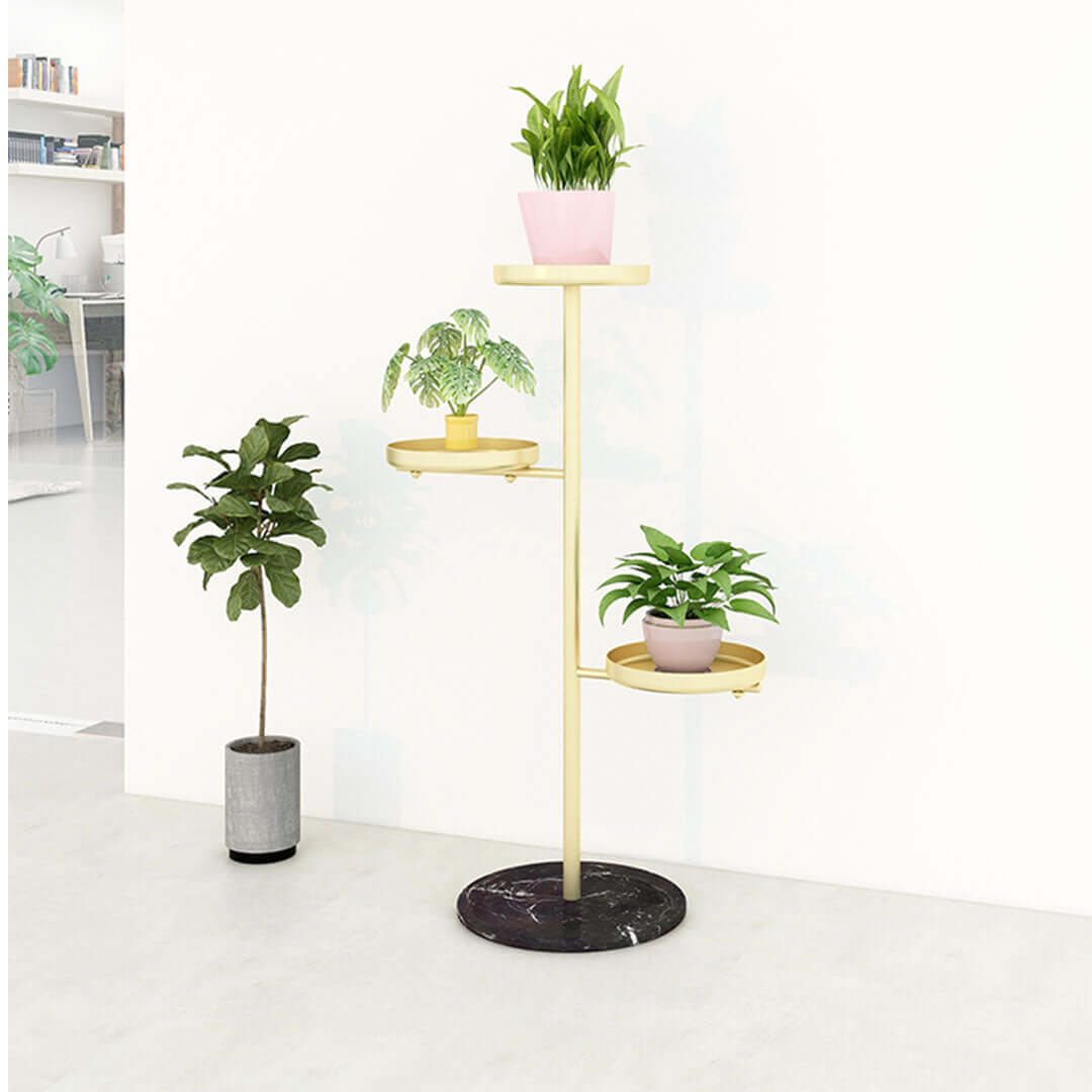 Stylish gold plant stand with multiple tiers holding potted plants, perfect affordable homeware for displaying quality indoor greenery.