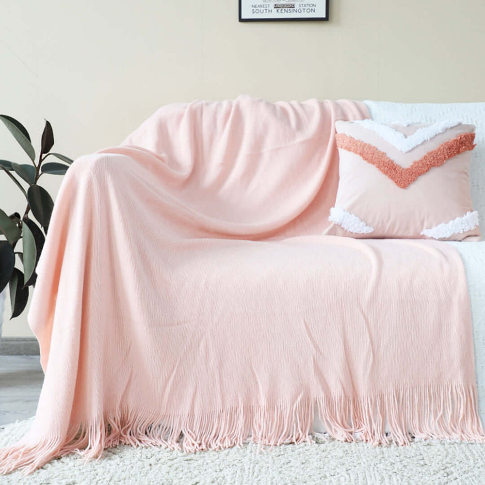 Affordable quality homewares - cozy pink throw blanket and decorative pillow on value furniture.