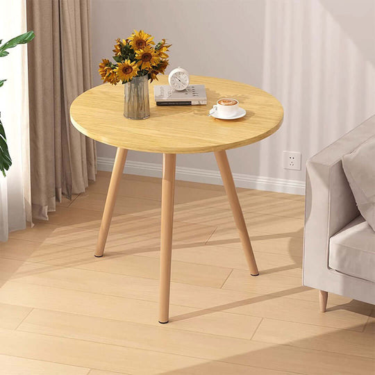 Stylish and affordable round wooden table with flowers, books, and teacup, showcasing quality homewares and value furniture for any room.