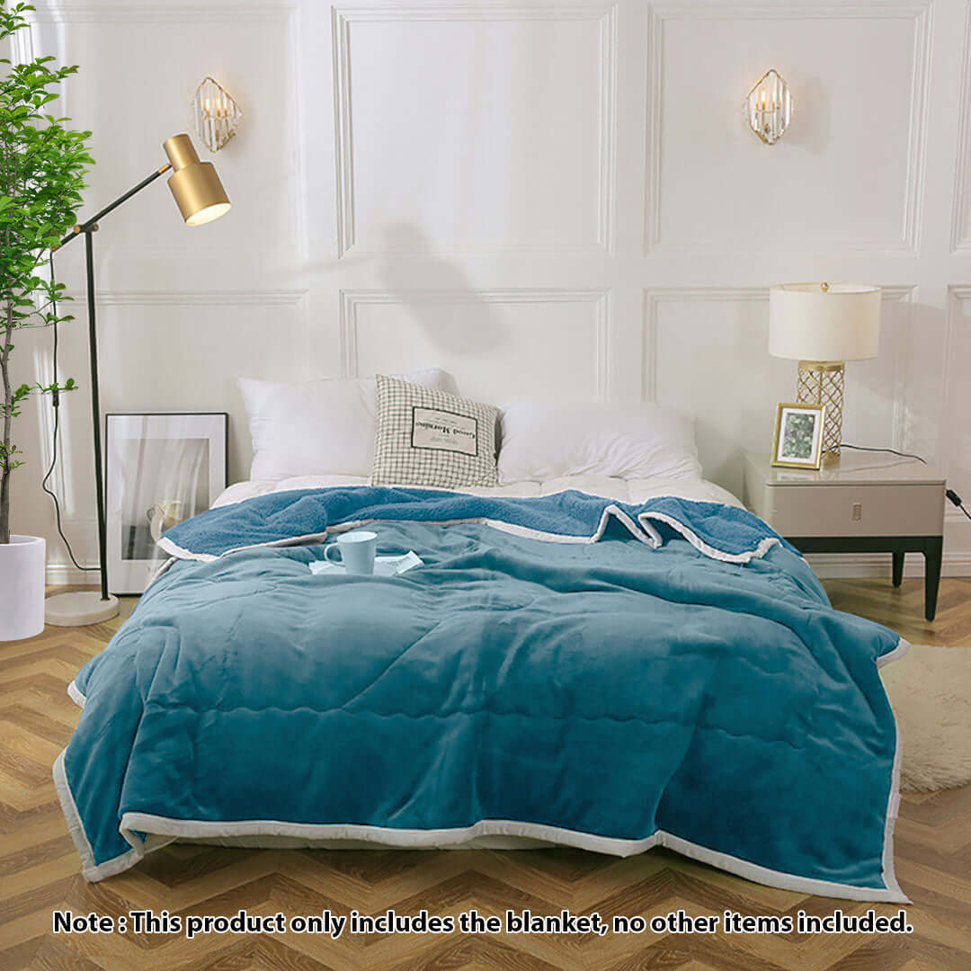 Affordable quality homewares - cozy teal blanket on bed in stylish bedroom setting. Value furniture for modern living. Note: only blanket included.