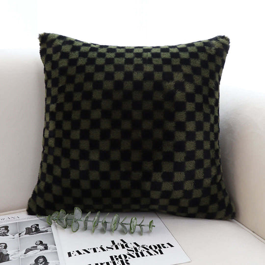 Checkered pillow on white couch, offering affordable homewares and quality value furniture.