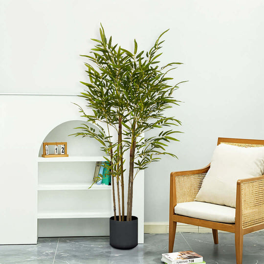 Stylish home interior with affordable quality homewares including a green potted plant, modern chair, and bookshelf enhancing value furniture.