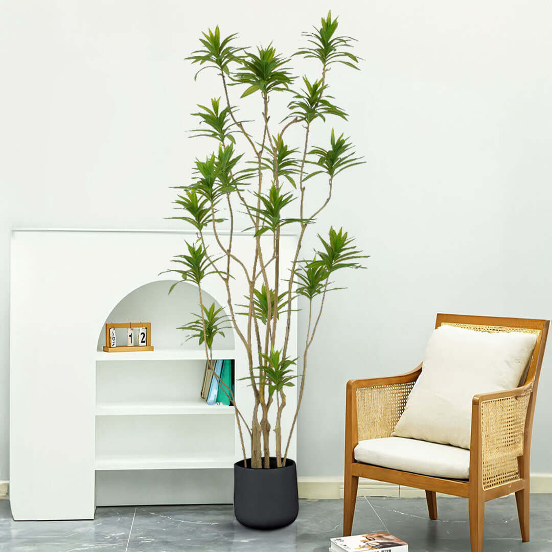 Stylish affordable homewares setup with a quality artificial plant, a modern white shelf, and a value furniture chair.