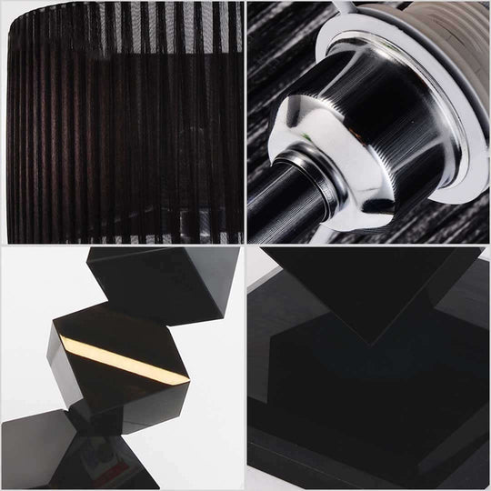 Close-up details of a modern black lamp with geometric shapes and a sleek metallic finish, highlighting affordable quality homewares and value furniture.