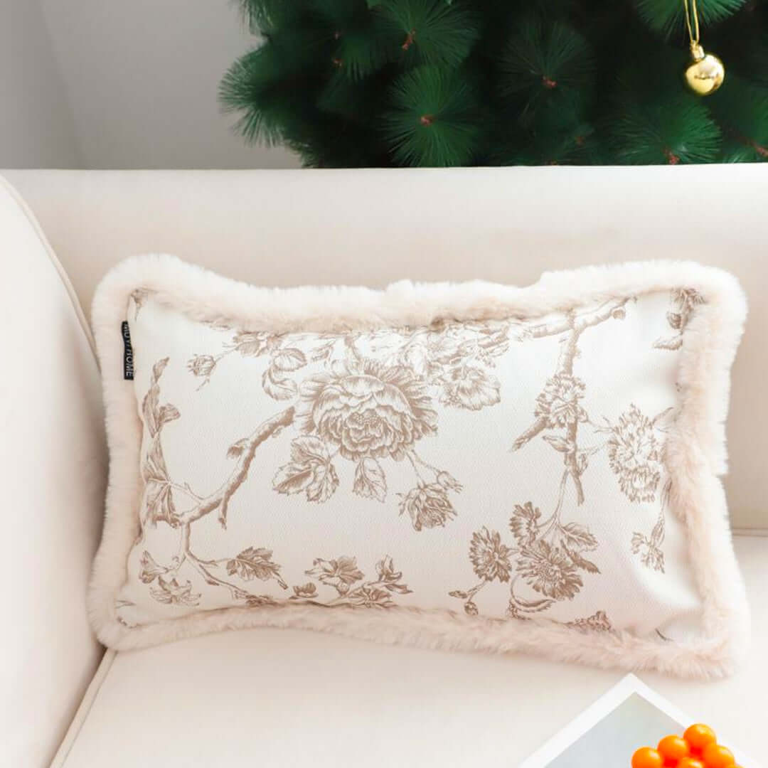 Affordable quality homewares - floral decorative cushion on a couch near a Christmas tree - value furniture for your home