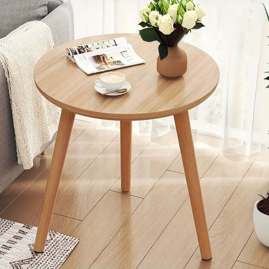 Affordable quality homewares - wooden round coffee table with vase, magazines, and cup - value furniture for living room décor.