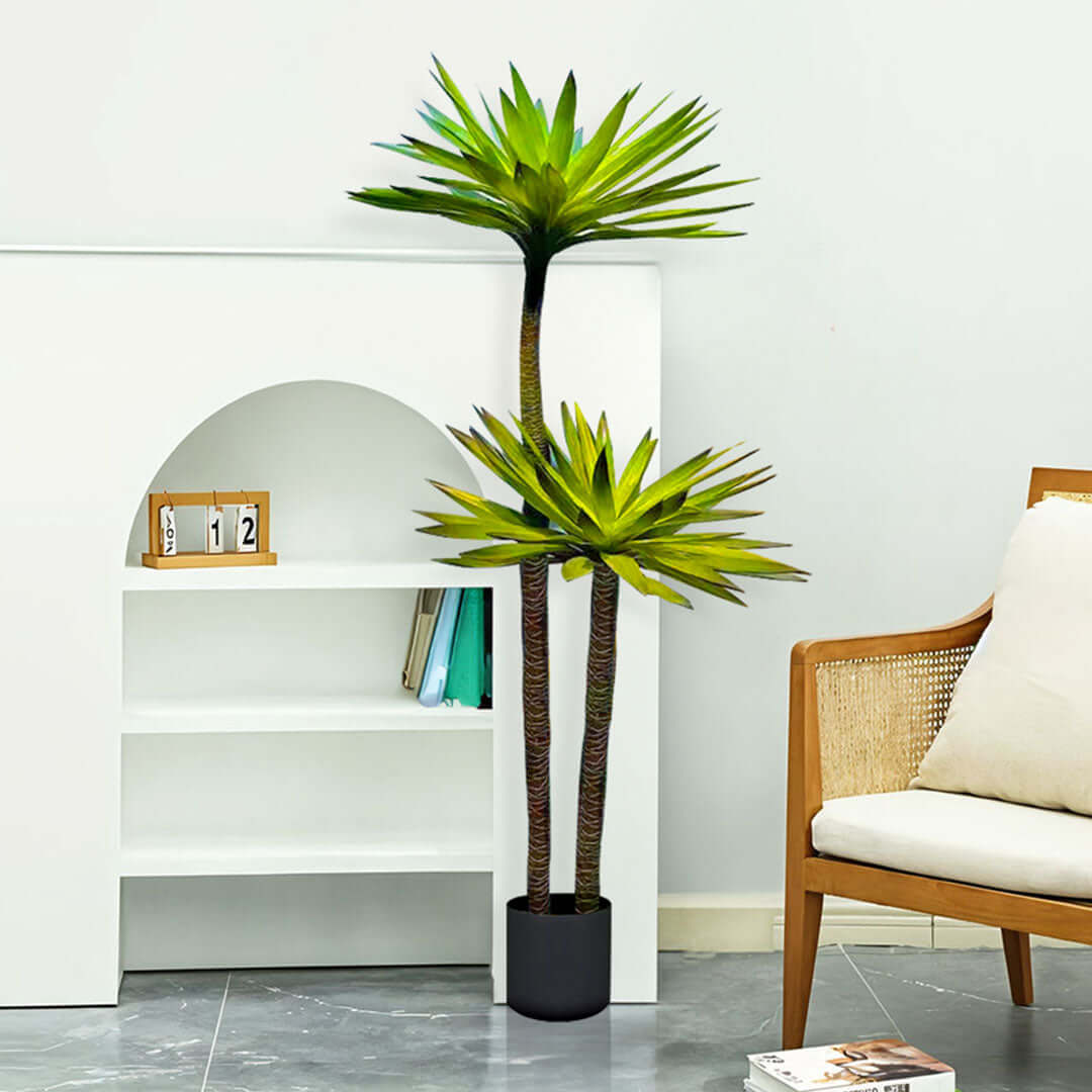 Affordable quality homeware featuring a tall artificial indoor plant in a modern living room with a chair and bookshelf for added value furniture