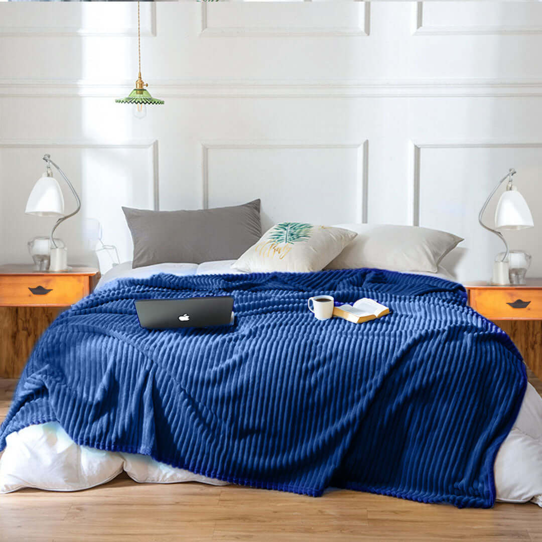 Comfortable bedroom with cozy blue blanket, value furniture, and affordable homewares for quality living.