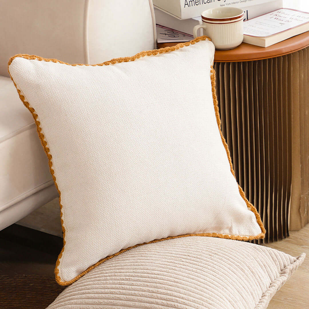 Affordable quality homewares, showcasing a stylish and comfortable white cushion on a value furniture setup.