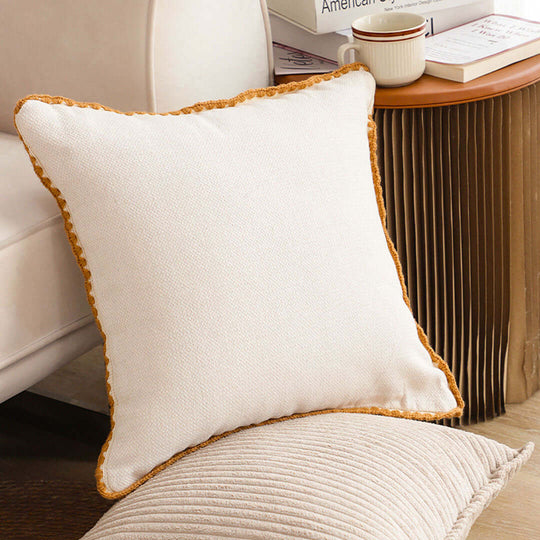 Affordable quality homewares, showcasing a stylish and comfortable white cushion on a value furniture setup.