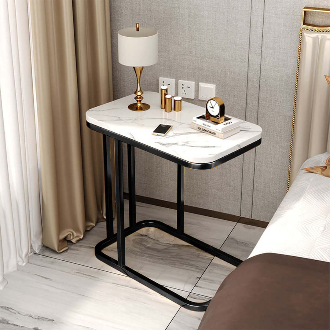 Affordable quality value furniture bedside table with lamp and decor items in a modern home setting.