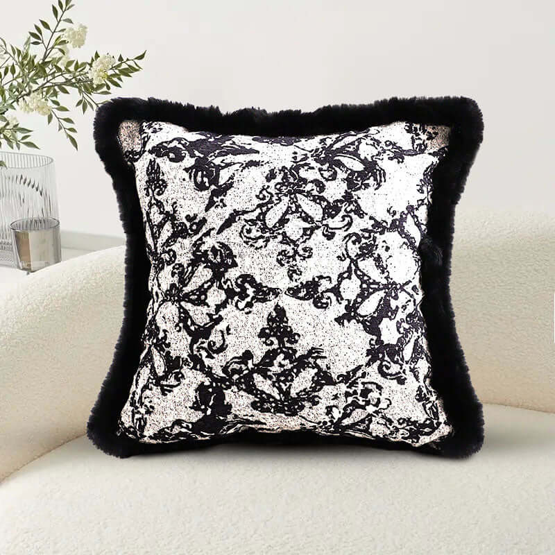 Stylish black and white decorative pillow on a cozy sofa, perfect for adding affordable, quality value to your homewares collection.