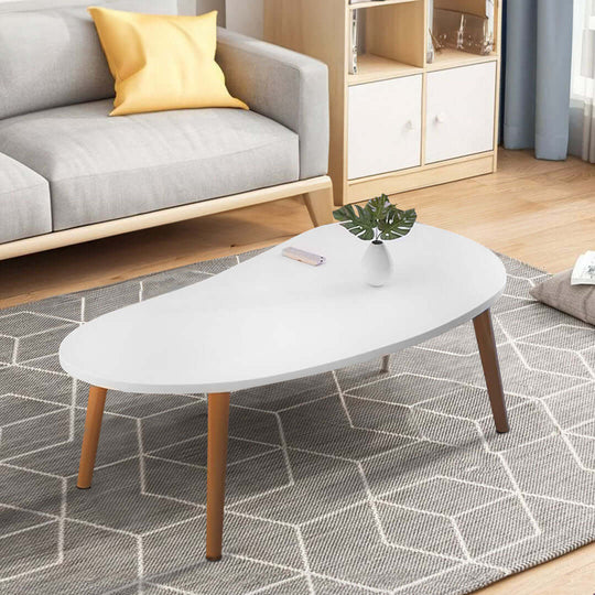 Affordable quality homewares including white modern coffee table in stylish living room with gray rug and value furniture.