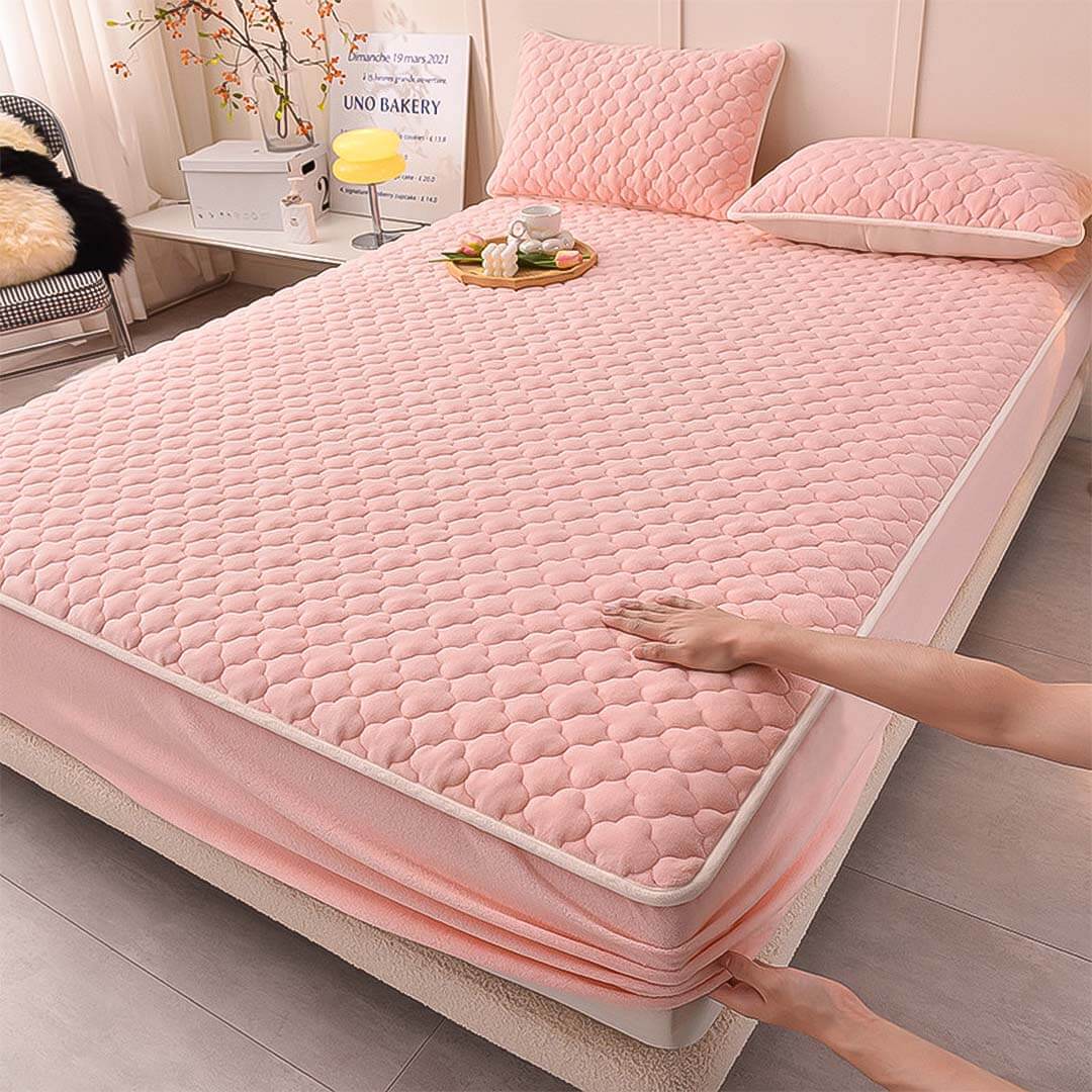 Affordable quality padded pink mattress cover on bed, showcasing value homewares and furniture.