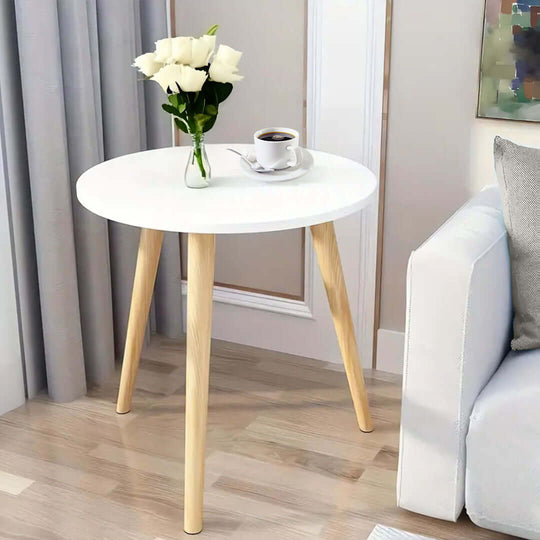 Affordable quality homeware round wooden table with flowers and a coffee cup, stylish value furniture for a modern living room.