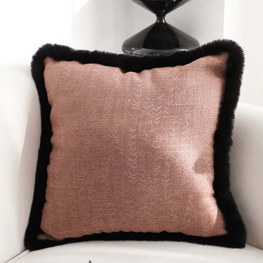 Affordable quality homewares pink cushion with black trim on white sofa for value furniture decor.