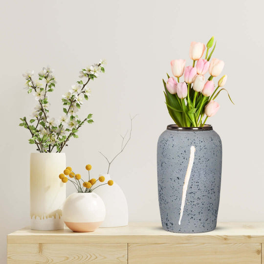 Affordable quality homewares with value furniture featuring elegant vases and flower arrangements on a wooden surface.