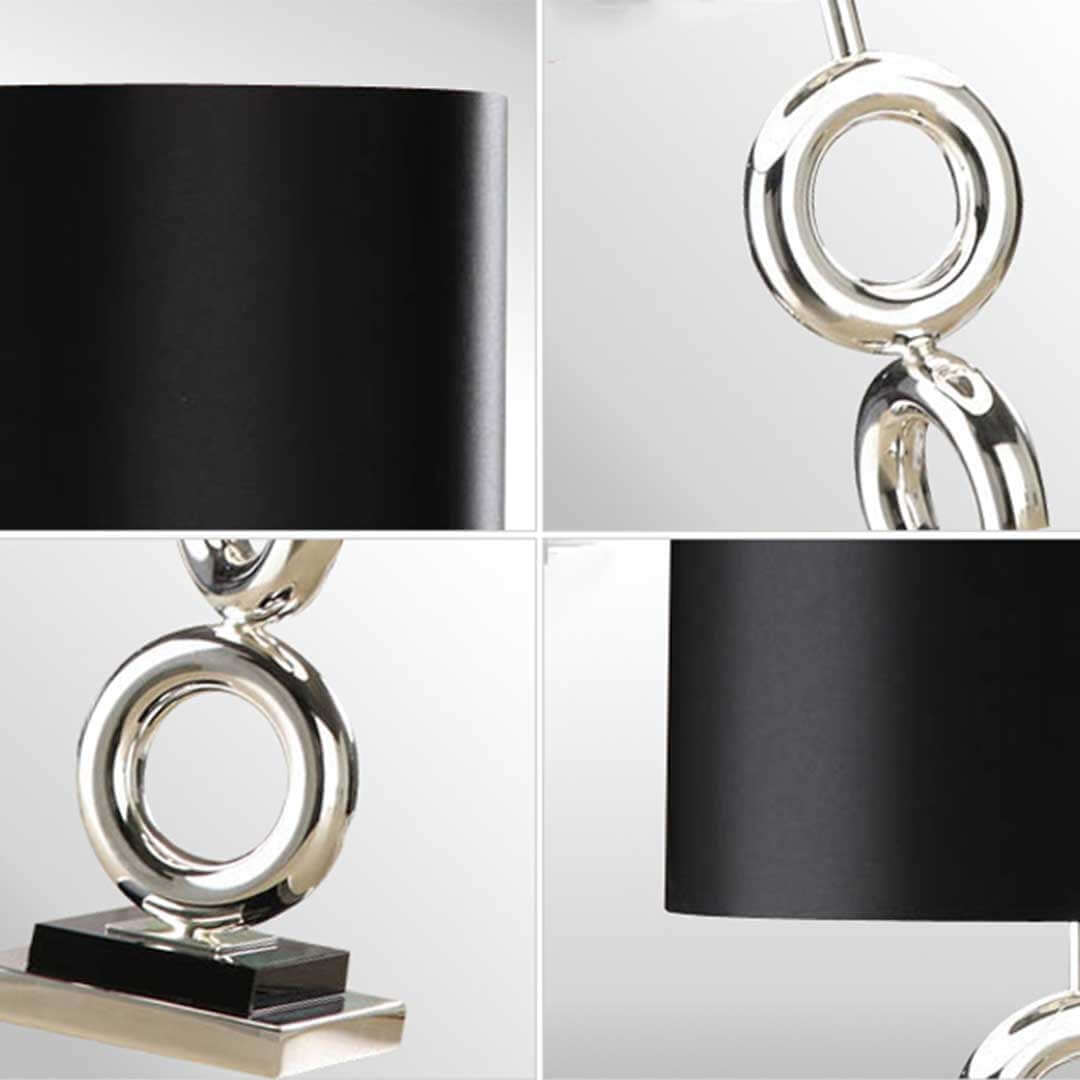 Modern black and silver table lamp with circular design, showcasing affordable homewares with quality and value furniture touches.