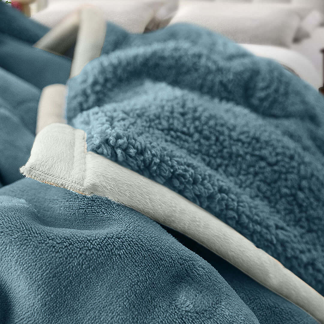 Soft and cozy blue throw blanket on a bed showcasing affordable and quality homewares with value furniture for a comfortable home.