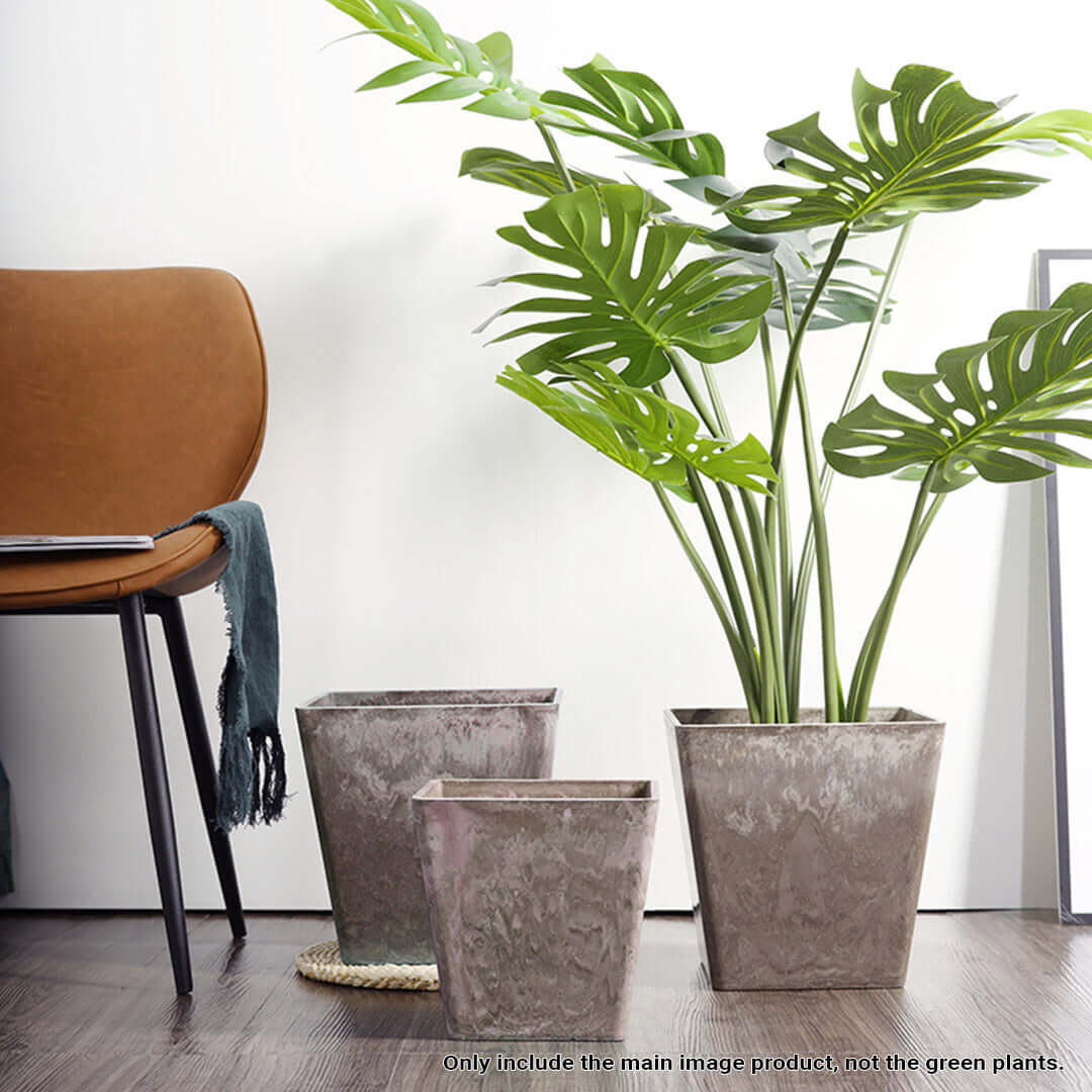 Affordable quality homewares featuring stylish value furniture with modern planter pots in a contemporary interior setting.