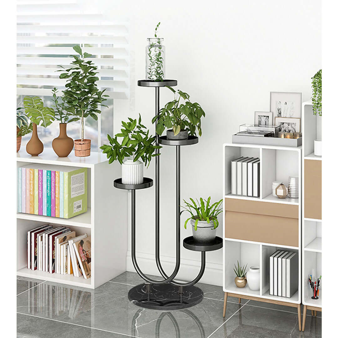 Affordable quality homewares and value furniture plant stand with bookshelves and modern decor in a stylish room.