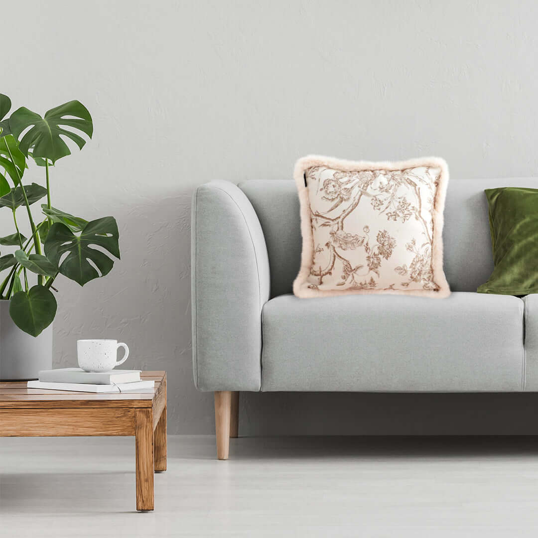 Affordable and quality homewares - cozy grey sofa with decorative cushion, wooden table, and plants - value furniture for living rooms.