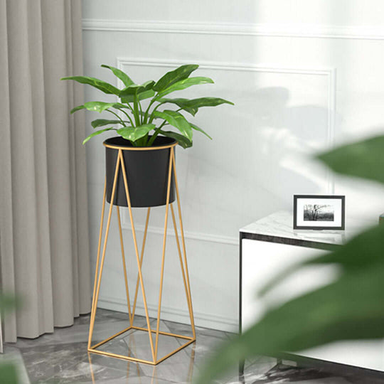 Elegant home decor with a modern plant stand and lush green plant, showcasing affordable homewares, quality, and value furniture.