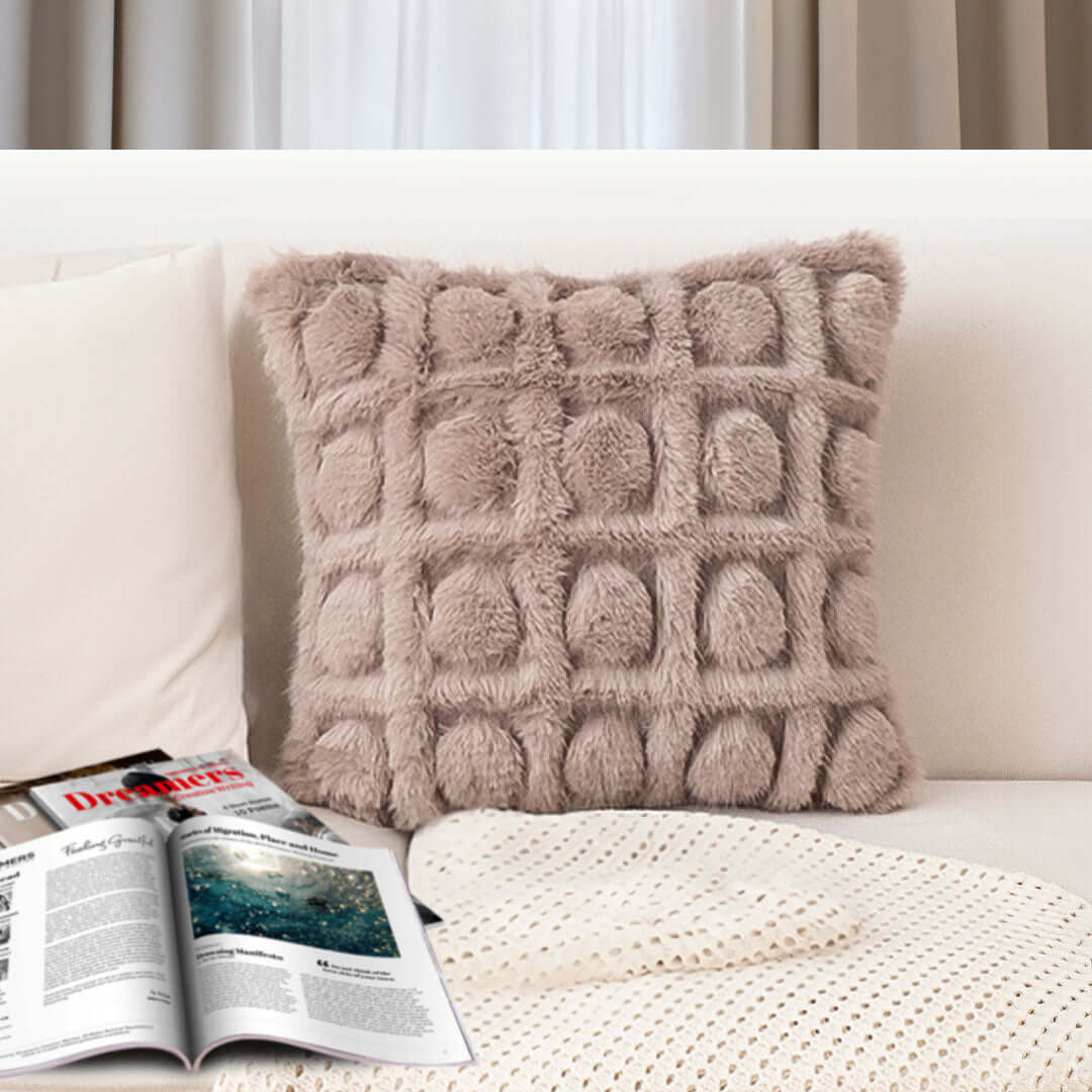 Affordable quality homewares – plush cushion with textured design on a cream sofa, enhancing value furniture decor.