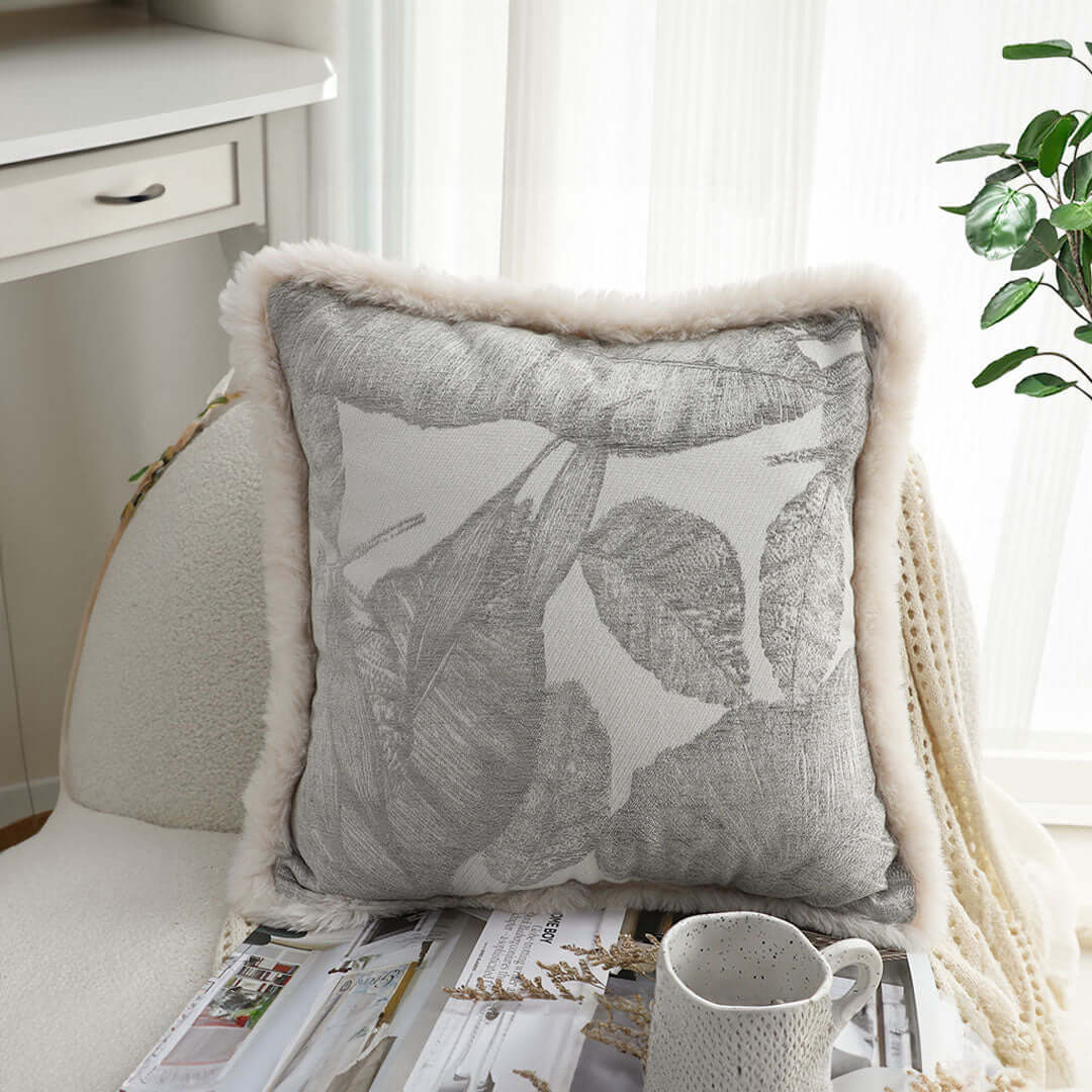 Affordable quality homewares - decorative cushion on chair with a cozy setting, offering value furniture for any home.